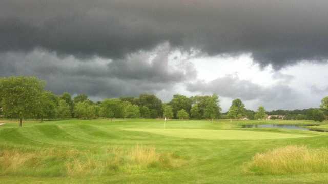 A view of storm clouds over a green at Wildcat Creek Golf Course.