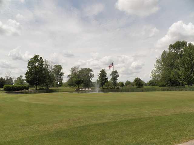 A view of a green with water coming into play at Coyote Creek Golf Club