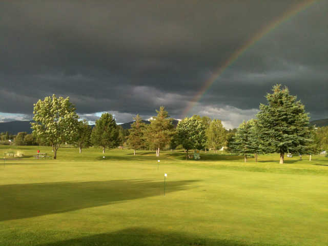 A view of a rainbow over the practice area at Linda Vista Golf Course