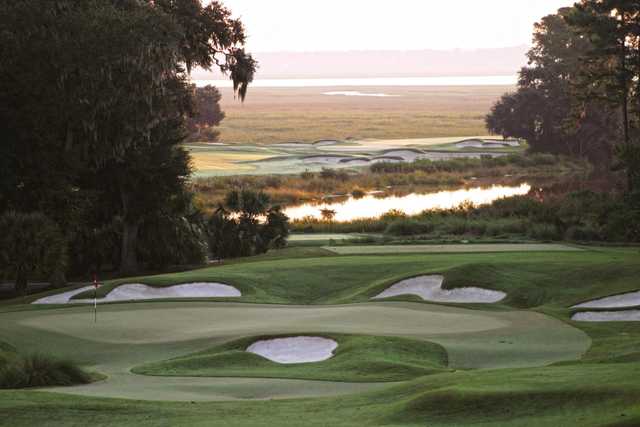 A view of a green surrounded by sand traps at West from Belfair Golf Club