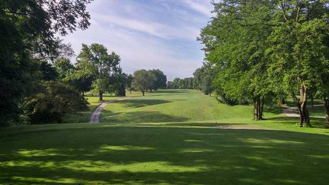 A sunny day view of a fairway at Crooked Lake Golf Course