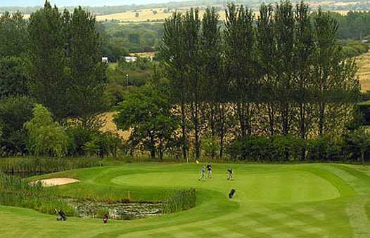 A view of a green with water coming into play from the left side at Marston Lakes Golf Club