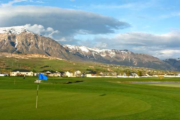A beautiful view of hole #17 with mountains in background at Remuda Golf Course