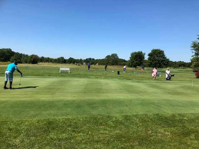 A view of the practice putting green and the driving range in background at Royal Hylands Golf Club.