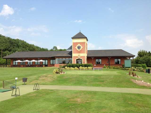 View of the clubhouse, putting green and raneg bay at The Welcombe Golf Club