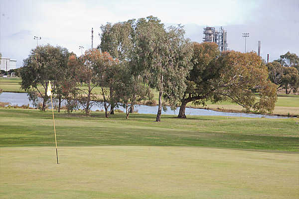 A view of green with water in background at Altona Lakes Golf Course