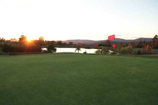 A view of a green with water coming into play at Wolf Ridge Golf Course
