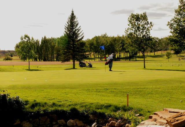 A sunny day view of a hole at Sidney Country Club.