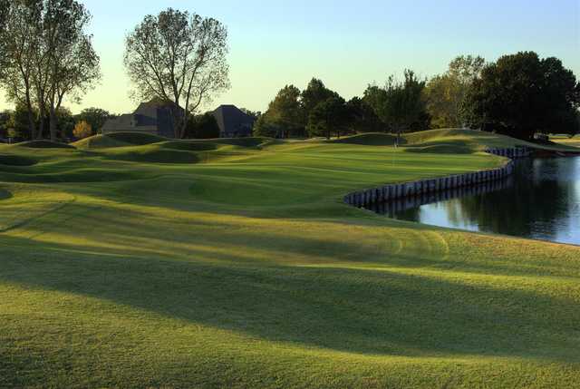 A view of the 14th hole with water coming into play at Oak Tree Country Club East Course