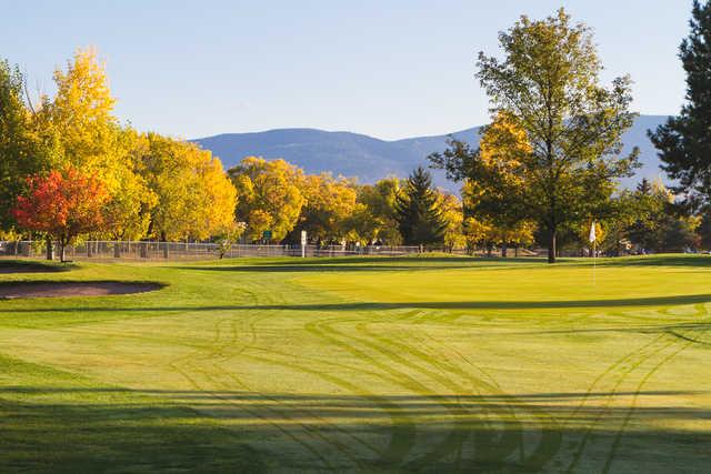 A fall day view of a green at Larchmont Golf Course.