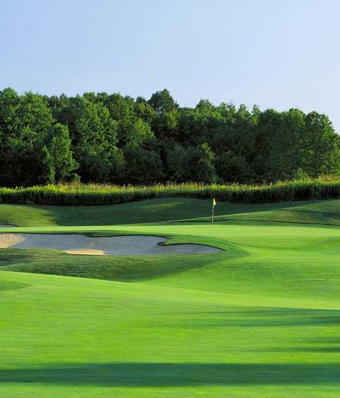 A view of a green with a bunker on the left at Double Eagle Club