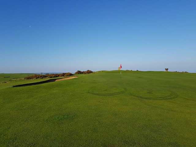A view of a green at Cleeve Hill Golf Club.