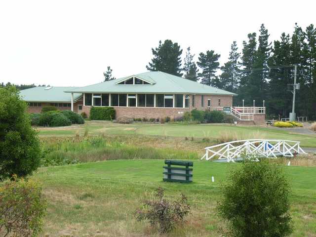 A view of a tee and the clubhouse at Llanherne Golf Club.