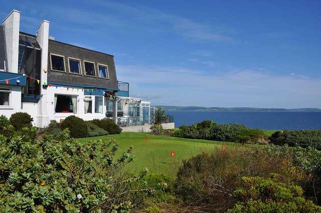 A view of the clubhouse and the practice putting green at Carnalea Golf Club