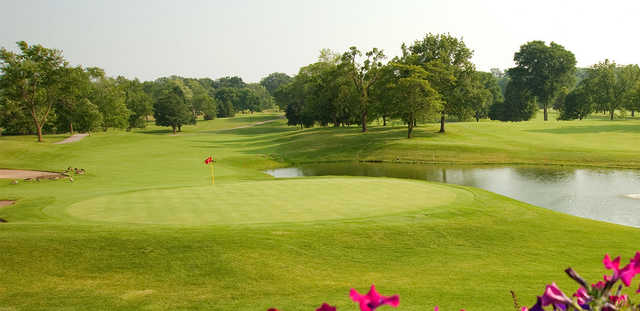 A view of a green with water coming into play from the right side at Orchard Ridge Country Club