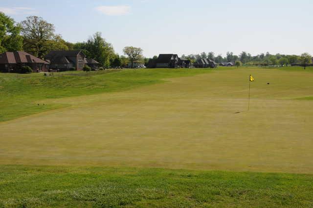 A sunny day view of a hole at Timbergate Golf Club.