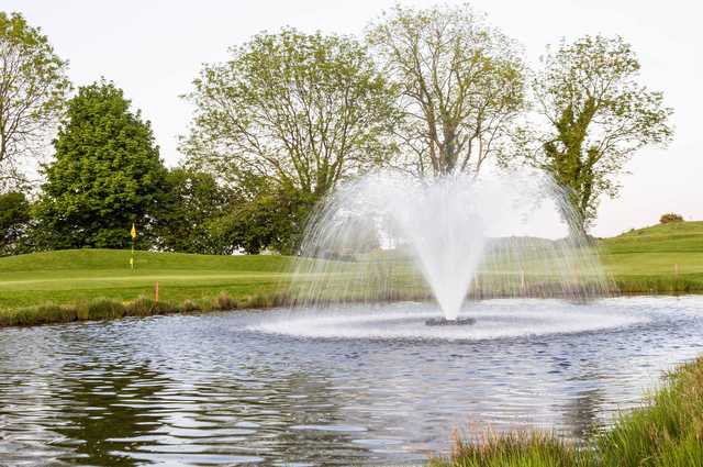 A view of a green protected by a water fountain at Blarney Golf Resort.