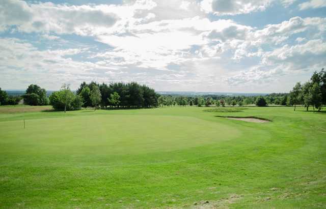 A sunny day view of a green at Chase Golf Club.
