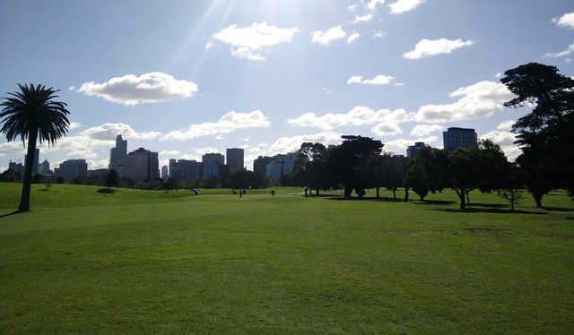 A sunny day view of a hole at Albert Park Golf Course.