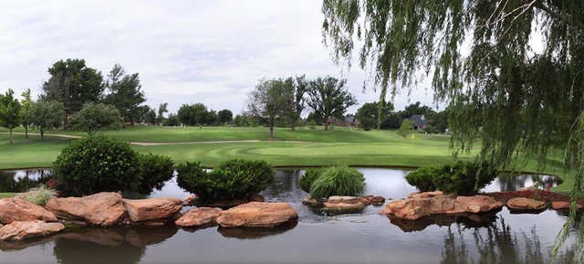 A view of a green with water coming into play at Quail Creek Golf & Country Club.