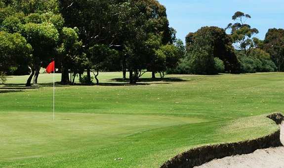 A view of green protected by bunker at Ivanhoe Golf Club