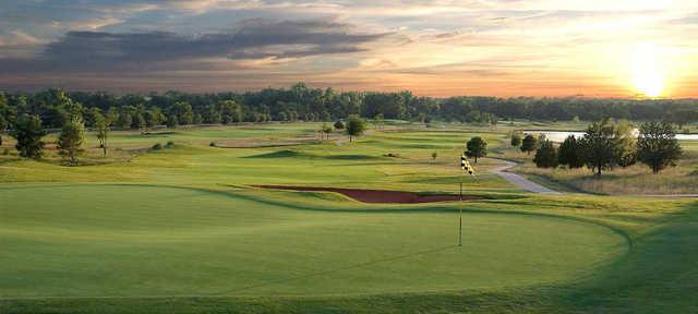 A sunset view of a hole at Belmar Golf Club.