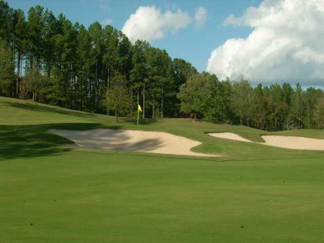 A view of the 11th green protected by bunkers at Ballantrae Golf Club