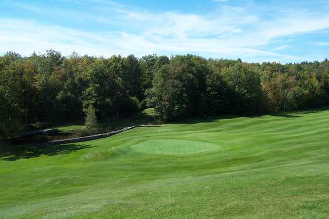 A sunny day view of a hole at Granliden On Sunapee Golf Course