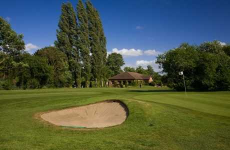 A view of a hole guarded by bunker at Datchet Golf Club