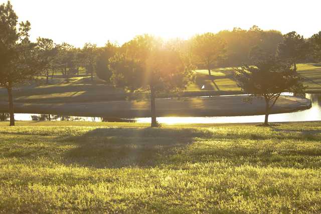 A view of the 7th green surrounded by water at Willow Brook Golf Course.
