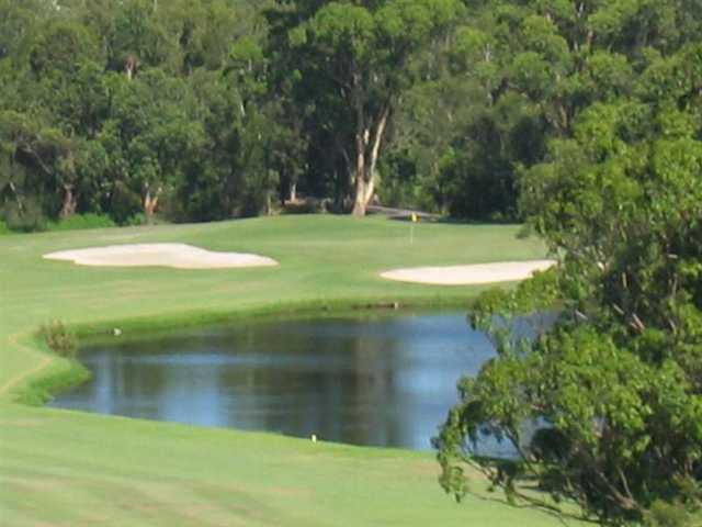 A view of green guarded by bunkers at Ocean Shores Country Club