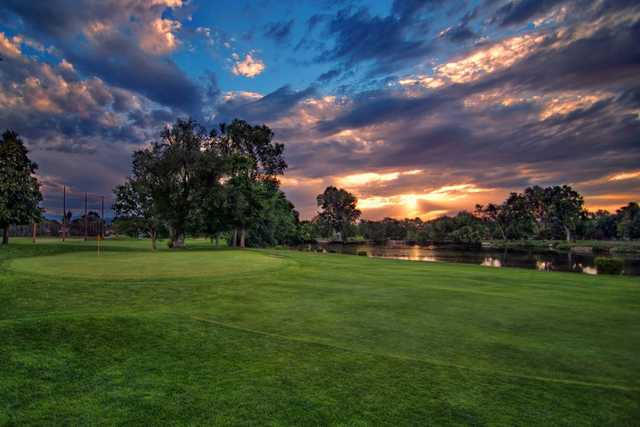 A view of a green with water on the right side at Nibley Park Golf Course.