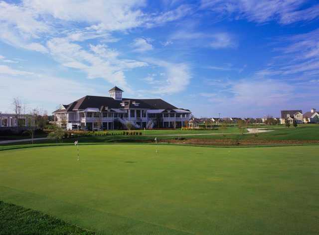 A view of the clubhouse and practice area at Heritage Shores Golf Club