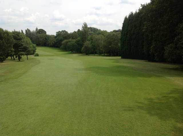 The tree lined 1st fairway at Cocks Moors Woods Golf Club