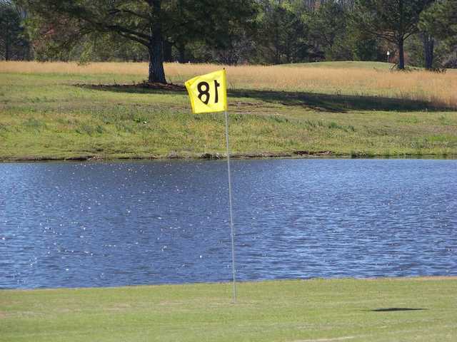 A view of the 18th hole with water coming into play at Whispering Pines Golf Course