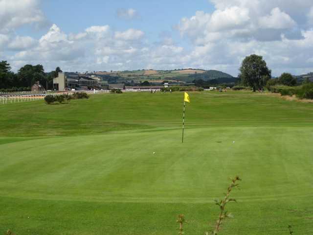A view of the 1st green and neighbouring grandstand at Ludlow Golf Club
