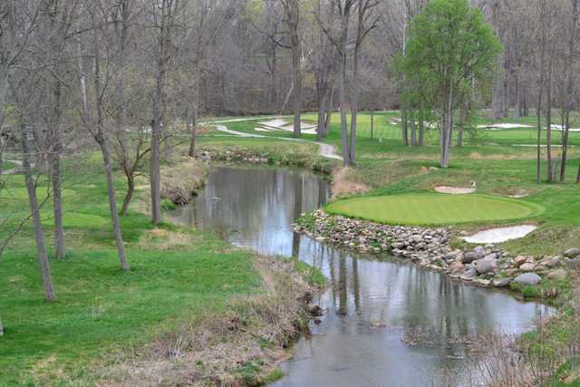 A view of the 16th green with water coming into play at Wolf Run Golf Club
