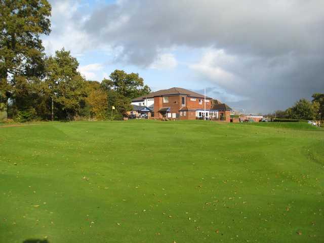 View of the 18th green and clubhouse at Penn Golf Club
