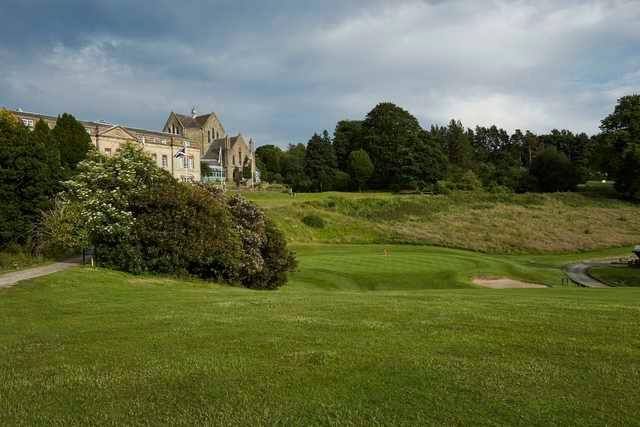 A sunny day view of a green at Shrigley Hall Hotel, Golf & Country Club.