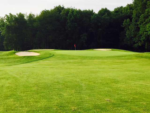 A view of a hole defended by sand traps at Green Acres Golf Club