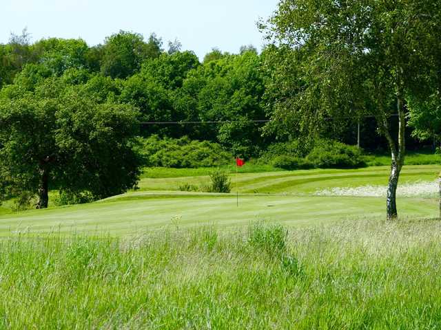 A sunny day view of a hole at Rye Hill Golf Club