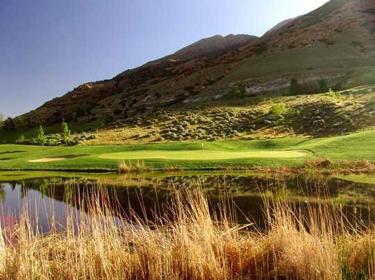 A view over the water of green at Old Mill Golf Club