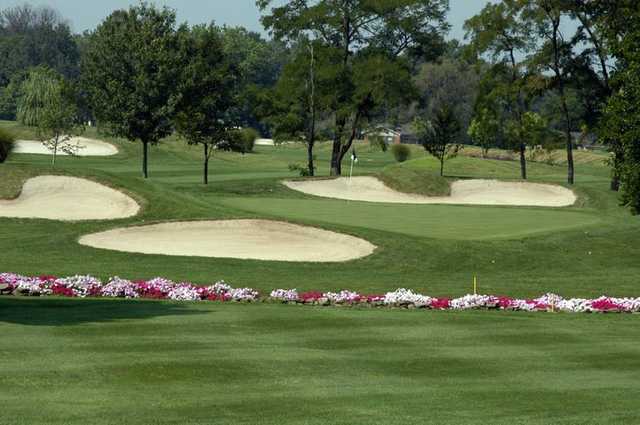 A view of a green guarded by a collection of bunkers at Balmoral Golf Club