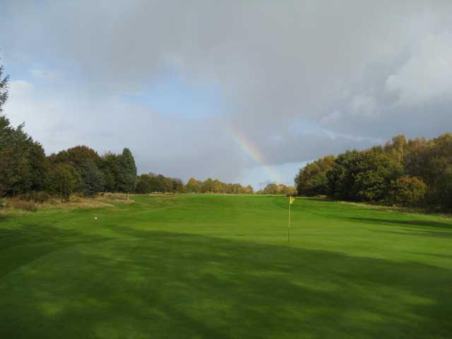 The beautiful 4th hole with a rainbow in the backdrop at Penn Golf Club