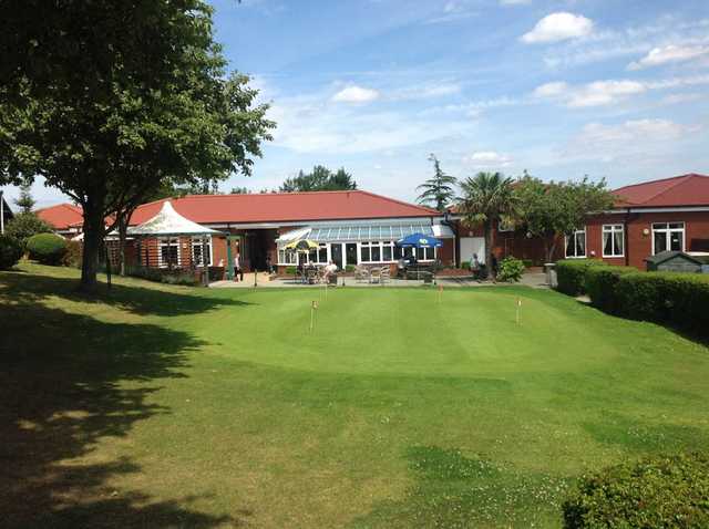 On the putting green at The Oaks Golf Centre