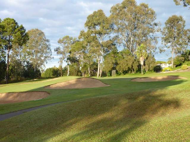 A view of the 9th green protected by bunkers at Pacific Golf Club