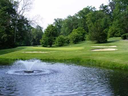 A view of a green protected by bunkers at Newark Country Club