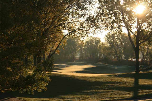A sunny day view of a hole at Dakota Dunes Country Club