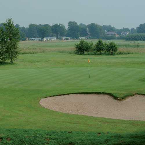 A view of a green guarded by bunker at Myerscough Golf Complex.