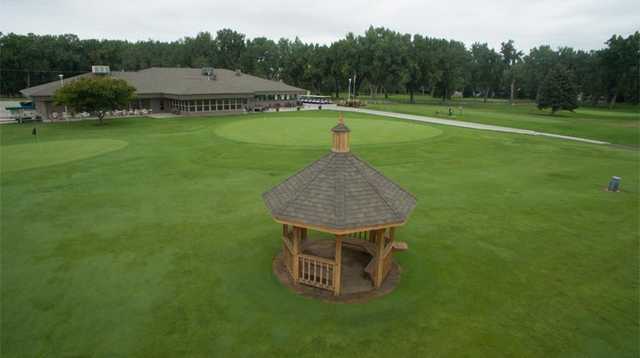 View of the clubhouse and putting green at Miles City Town & Country Club.